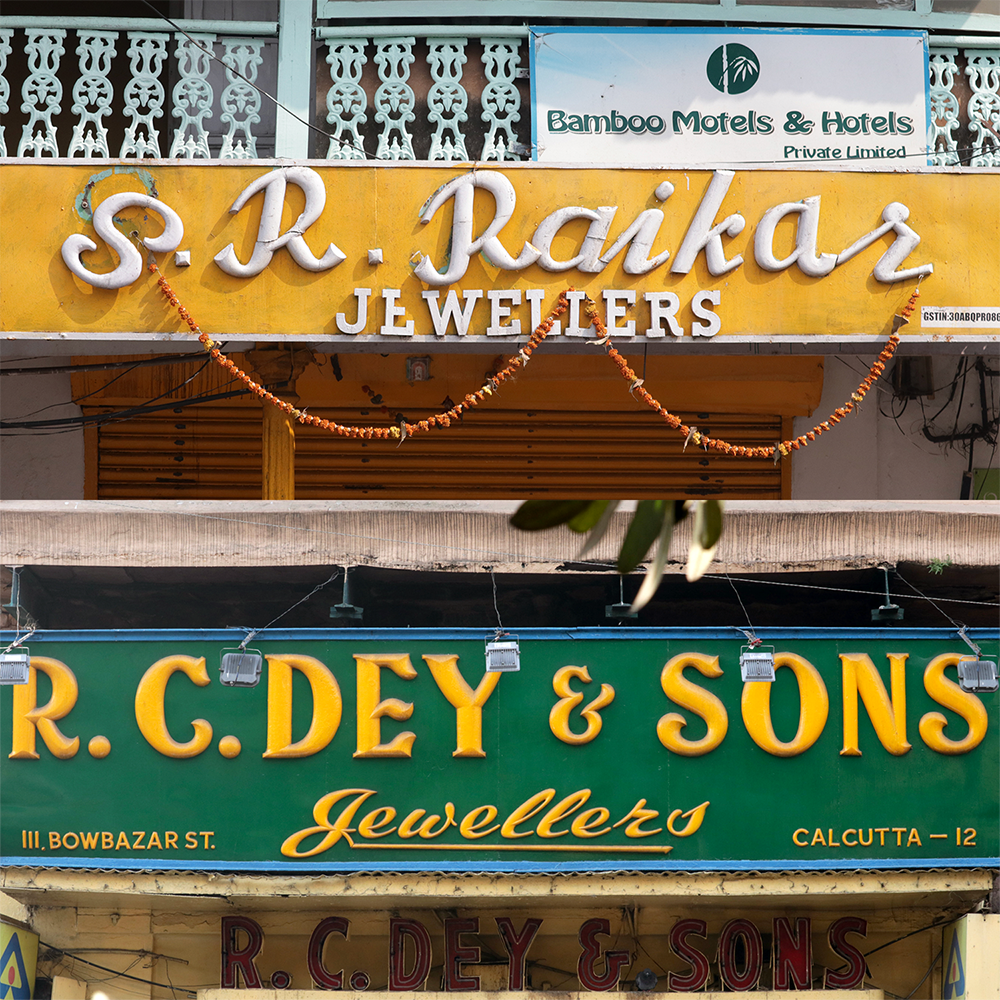 A collection of jewellery shop signs made in wood